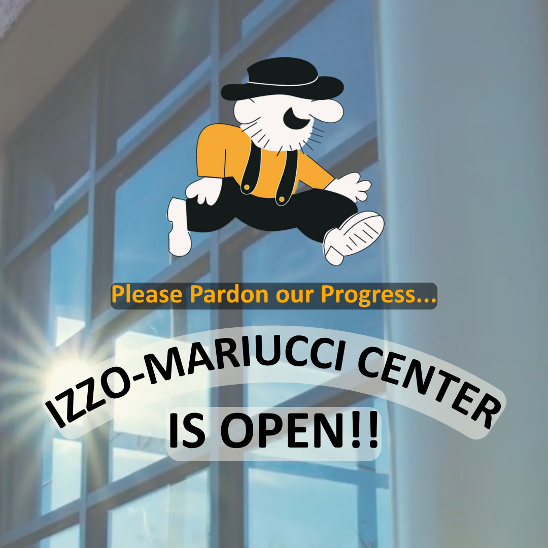 Exterior shot of the glass facade of the Izzo-Mariucci Center, with light reflecting off the large windows. A wide, arched white banner with bold black lettering curves across the top of the graphic reading "THE IZZO-MARIUCCI CENTER". Directly underneath, centered in a rounded light-gray box, bold black text reads "IS OPEN!!" with two exclamation points.